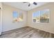 Bright bedroom with two windows and ceiling fan at 7909 Dutch Canyon Ct, Las Vegas, NV 89131