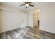 Spacious bedroom with ceiling fan and wood-look flooring at 7909 Dutch Canyon Ct, Las Vegas, NV 89131