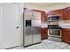 Stainless steel appliances and wood cabinetry in a well-lit kitchen at 7909 Dutch Canyon Ct, Las Vegas, NV 89131