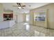 Bright living room with tile flooring and ceiling fan at 7909 Dutch Canyon Ct, Las Vegas, NV 89131