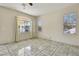 Living room featuring tile floors and backyard view at 7909 Dutch Canyon Ct, Las Vegas, NV 89131