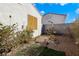 Landscaped side yard with rock garden and desert plants at 7909 Dutch Canyon Ct, Las Vegas, NV 89131