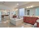 Luxurious bathroom with double vanity, soaking tub, and tile floors at 7923 Sleeping Lily Dr, Las Vegas, NV 89178