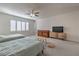 Bright bedroom with two beds, ceiling fan and ample space at 7923 Sleeping Lily Dr, Las Vegas, NV 89178