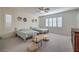 Spacious bedroom with two twin beds, ceiling fan, and large windows at 7923 Sleeping Lily Dr, Las Vegas, NV 89178