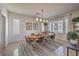 Bright dining room with an oval table and six chairs at 7923 Sleeping Lily Dr, Las Vegas, NV 89178