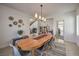 Elegant dining room featuring an oval wood table and modern chairs at 7923 Sleeping Lily Dr, Las Vegas, NV 89178