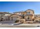 Two-story house with stone accents and a three-car garage at 7923 Sleeping Lily Dr, Las Vegas, NV 89178