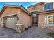 Front entrance with stone detailing and a double door at 7923 Sleeping Lily Dr, Las Vegas, NV 89178