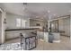 Modern kitchen with gray cabinets and a large island at 7923 Sleeping Lily Dr, Las Vegas, NV 89178