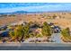 Aerial view of single story home with large yard and mountain views at 8365 Hauck St, Las Vegas, NV 89139