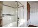 Bathroom with a shower/tub combo, tiled walls, and a linen closet at 8365 Hauck St, Las Vegas, NV 89139