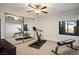 Home gym with two spin bikes, mirrored closet doors, and a window with a view at 8365 Hauck St, Las Vegas, NV 89139