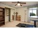 Versatile bedroom with a treadmill, built-in shelving, and a mirrored closet at 8365 Hauck St, Las Vegas, NV 89139