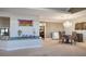 Dining area with chandelier lighting, a round table, and access to kitchen and living spaces at 8365 Hauck St, Las Vegas, NV 89139