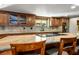 Large kitchen island with granite countertop and seating at 8365 Hauck St, Las Vegas, NV 89139