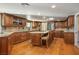 Spacious kitchen featuring custom cabinetry, granite countertops, and hardwood floors at 8365 Hauck St, Las Vegas, NV 89139