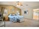 Bright main bedroom featuring a ceiling fan, natural light, and an ensuite bathroom at 8365 Hauck St, Las Vegas, NV 89139