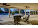 Covered patio overlooking the pool with ceiling fans and outdoor seating at 8365 Hauck St, Las Vegas, NV 89139