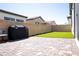 Artificial turf backyard with built-in grill at 862 Silverton Springs St, Henderson, NV 89011