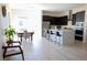 Modern kitchen featuring dark cabinetry, a large island, and stainless steel appliances at 862 Silverton Springs St, Henderson, NV 89011