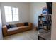 Relaxing home office featuring a brown leather couch and built-in shelving at 862 Silverton Springs St, Henderson, NV 89011