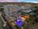 An aerial view of the backyard showcasing a pool, spa, outdoor kitchen, and lush landscaping at 8620 Grove Mill Ct, Las Vegas, NV 89139