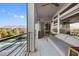 Enjoy outdoor living on this covered balcony with stylish furniture and a view of the inviting pool at 8620 Grove Mill Ct, Las Vegas, NV 89139