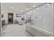 Spa-like bathroom featuring a soaking tub, walk-in shower, and marble flooring at 8620 Grove Mill Ct, Las Vegas, NV 89139