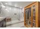 Modern bathroom featuring a glass shower and a luxurious wooden sauna for ultimate relaxation at 8620 Grove Mill Ct, Las Vegas, NV 89139