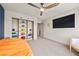 Spacious bedroom with ample closet space, ceiling fan, and modern decor at 8620 Grove Mill Ct, Las Vegas, NV 89139