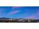 Distant skyline view of the city from the rooftop, set against a vibrant blue sky at 8620 Grove Mill Ct, Las Vegas, NV 89139