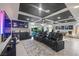Entertainment area with theater seats, game table, wet bar, and patio access at 8620 Grove Mill Ct, Las Vegas, NV 89139