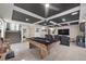 Spacious game room with a pool table, theater seating, custom ceiling, and access to a staircase at 8620 Grove Mill Ct, Las Vegas, NV 89139