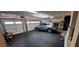 Spacious two-car garage equipped with exercise equipment and ample storage space at 8620 Grove Mill Ct, Las Vegas, NV 89139