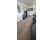Garage features a gray car parked on the side with water filtration system and water heater at 8620 Grove Mill Ct, Las Vegas, NV 89139