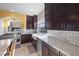 Stylish kitchen boasts granite countertops, stainless appliances, and elegant cabinetry for a modern aesthetic at 8620 Grove Mill Ct, Las Vegas, NV 89139