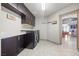 Laundry room with washer, dryer, and ample cabinet space at 8620 Grove Mill Ct, Las Vegas, NV 89139