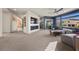 Open-concept living room with a fireplace, a tv, and access to the outside at 8620 Grove Mill Ct, Las Vegas, NV 89139
