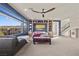 Spacious living area with a large window, custom built-ins, and an open staircase at 8620 Grove Mill Ct, Las Vegas, NV 89139