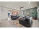 Inviting living room with a modern ceiling fan and comfortable seating at 8620 Grove Mill Ct, Las Vegas, NV 89139
