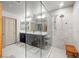 The sleek bathroom includes a glass shower and double vanity sinks at 8620 Grove Mill Ct, Las Vegas, NV 89139