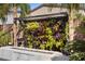 Backyard fire feature with elegant tile work and lush floral arrangement at 8620 Grove Mill Ct, Las Vegas, NV 89139