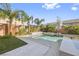 Inviting backyard pool with beautiful landscaping, a waterfall feature, and a basketball hoop for recreation at 8620 Grove Mill Ct, Las Vegas, NV 89139