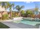 Beautiful pool area featuring an outdoor waterfall, basketball hoop, and a verdant living wall at 8620 Grove Mill Ct, Las Vegas, NV 89139