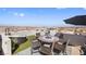 Relax on this rooftop patio, featuring comfortable seating and panoramic city views, perfect for outdoor entertaining at 8620 Grove Mill Ct, Las Vegas, NV 89139