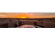 Rooftop patio with stylish seating and stunning sunset views over the mountains at 8620 Grove Mill Ct, Las Vegas, NV 89139