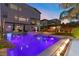 Beautiful backyard oasis with a large swimming pool, spa, and outdoor kitchen area at 8620 Grove Mill Ct, Las Vegas, NV 89139