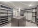 Large walk-in closet with shelving and drawers for organized storage at 8620 Grove Mill Ct, Las Vegas, NV 89139