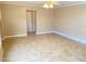 Large living room with tile floors and ceiling fan at 8760 Harvest Valley Ave, Las Vegas, NV 89129